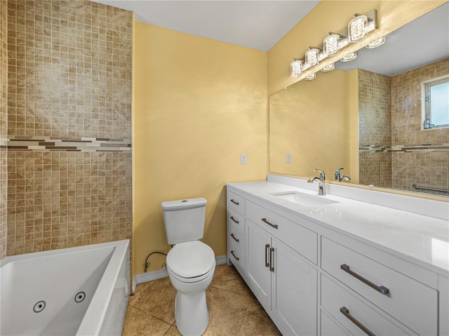 bathroom with toilet, vanity, tile patterned floors, and a bathtub