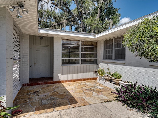 doorway to property with a patio area