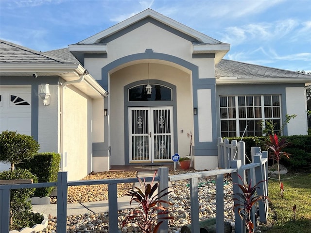 view of exterior entry with a garage