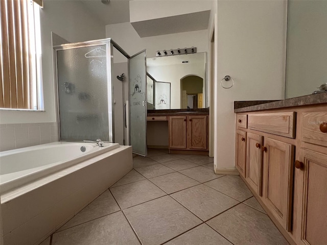 bathroom with vanity, independent shower and bath, and tile patterned floors