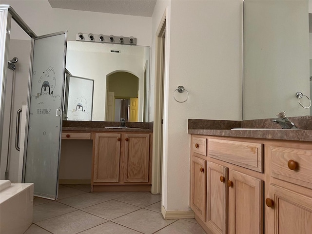 bathroom with vanity and tile patterned floors