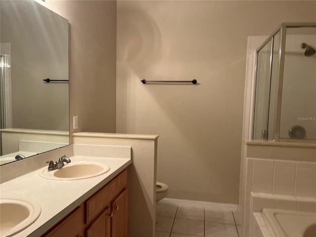 bathroom with tile patterned floors, walk in shower, vanity, and toilet