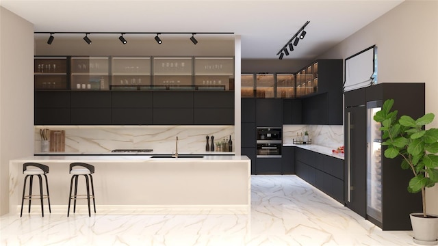 kitchen with decorative backsplash, a kitchen breakfast bar, black double oven, and sink