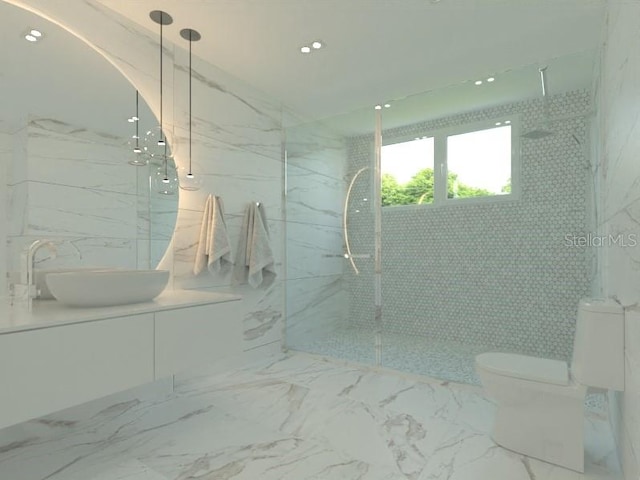 bathroom featuring vanity, toilet, tiled shower, and tile walls