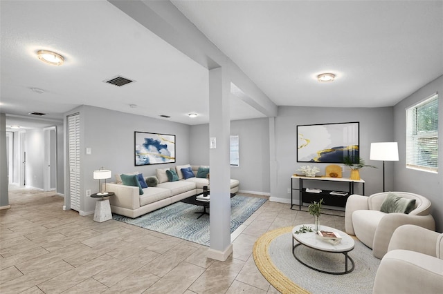 living room featuring lofted ceiling