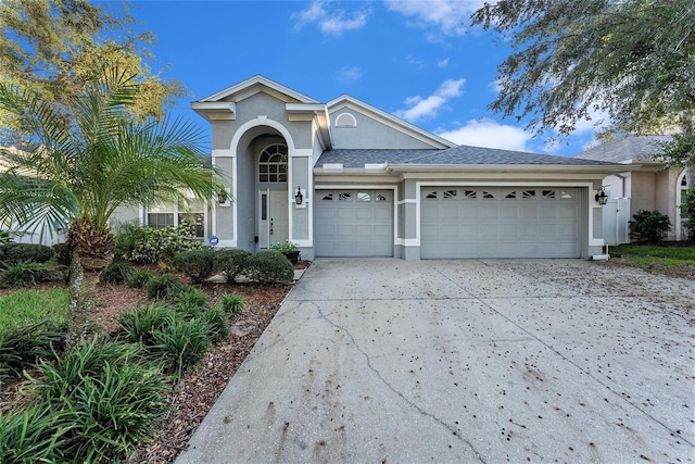 view of front of property with a garage