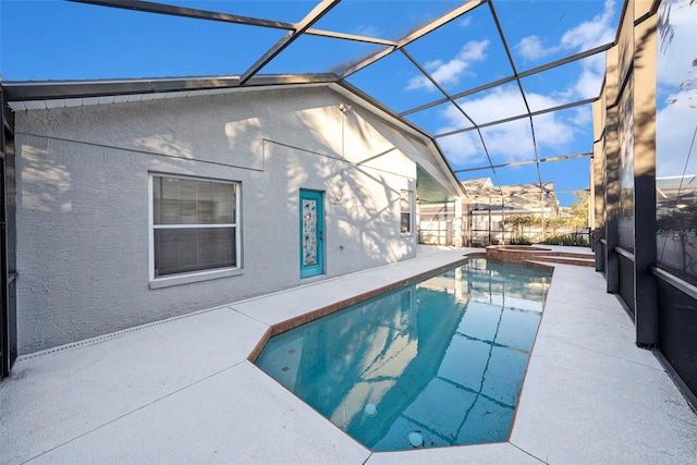 view of pool featuring a lanai and a patio area