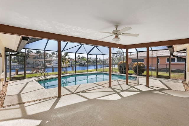 view of swimming pool with a water view, ceiling fan, a lanai, and a patio area