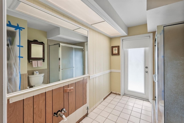 doorway featuring light tile patterned floors