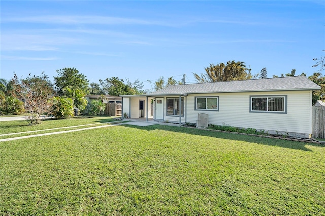 ranch-style house with a front lawn