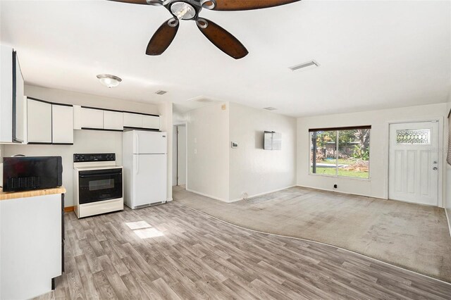 kitchen featuring ceiling fan, white cabinetry, electric range, white refrigerator, and light hardwood / wood-style floors