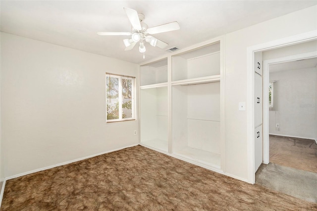 unfurnished bedroom with a closet, ceiling fan, and carpet