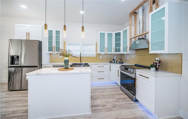 kitchen featuring a center island, appliances with stainless steel finishes, pendant lighting, and white cabinetry