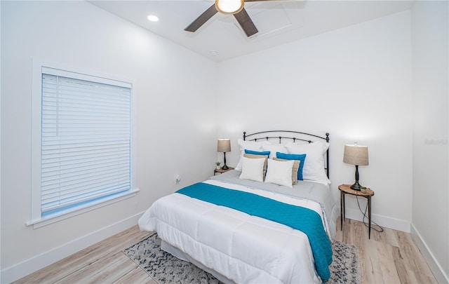 bedroom with light hardwood / wood-style flooring and ceiling fan