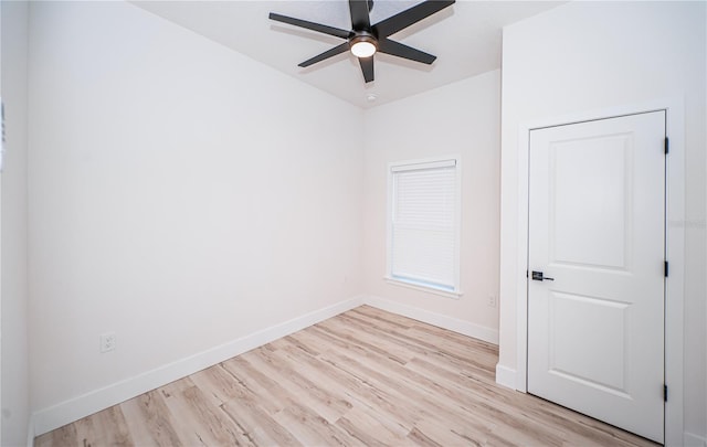 empty room with light hardwood / wood-style floors and ceiling fan