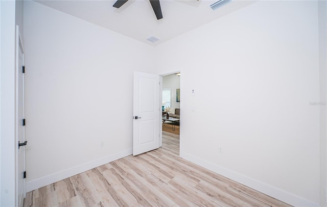 spare room featuring ceiling fan and light wood-type flooring