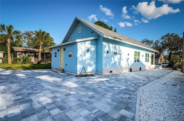 view of home's exterior with a patio area