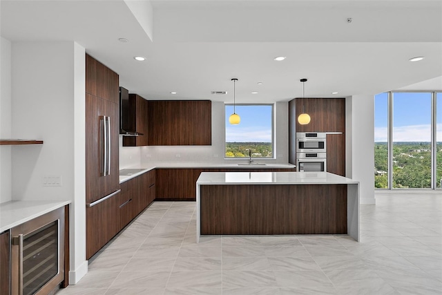 777 3rd Ave N Unit 1203, Saint Petersburg, FL 33701 - kitchen featuring modern cabinets, beverage cooler, a sink, light countertops, and recessed lighting