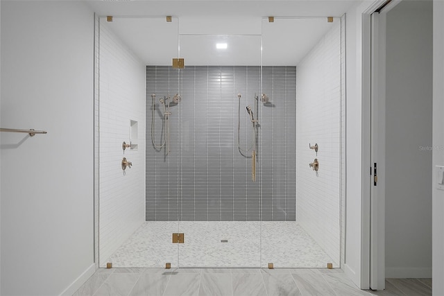 777 3rd Ave N Unit 1203, Saint Petersburg, FL 33701 - bathroom with a tile shower, tile patterned floors, and baseboards