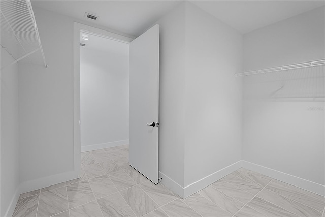 777 3rd Ave N Unit 1203, Saint Petersburg, FL 33701 - walk in closet with light marble finish floors