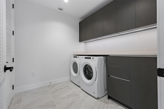 777 3rd Ave N Unit 1203, Saint Petersburg, FL 33701 - laundry area with washer and dryer, cabinet space, and baseboards