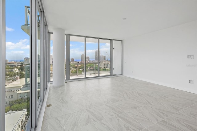 777 3rd Ave N Unit 1203, Saint Petersburg, FL 33701 - spare room with a city view and floor to ceiling windows