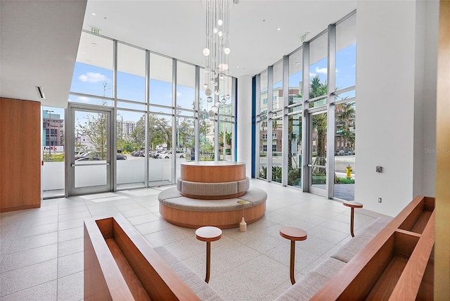 777 3rd Ave N Unit 1203, Saint Petersburg, FL 33701 - community lobby with a high ceiling and a wall of windows