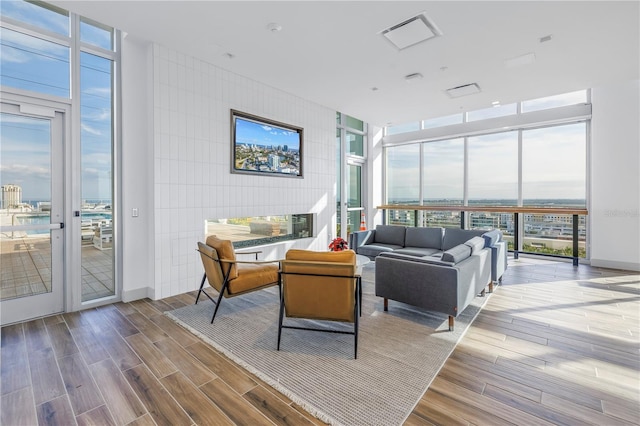 777 3rd Ave N Unit 1203, Saint Petersburg, FL 33701 - living room featuring expansive windows and wood finished floors