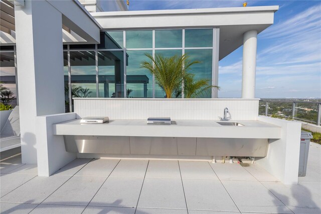 777 3rd Ave N Unit 1203, Saint Petersburg, FL 33701 - view of patio with a sink and an outdoor kitchen