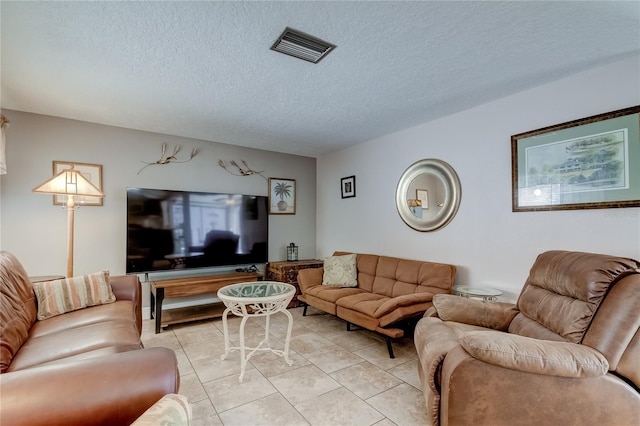 tiled living room with a textured ceiling