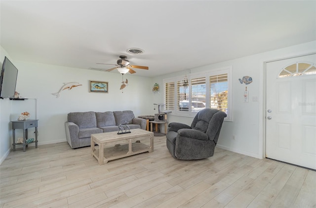 living room featuring light wood-type flooring and ceiling fan