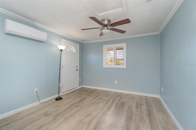 spare room with an AC wall unit, ornamental molding, light hardwood / wood-style flooring, and ceiling fan