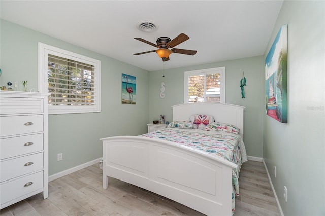 bedroom featuring light wood-type flooring and ceiling fan