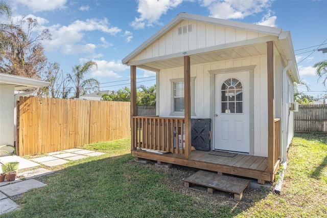 doorway to property featuring a yard