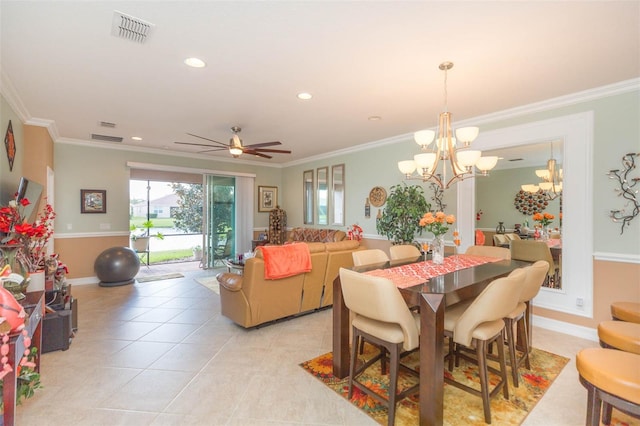 tiled dining room with crown molding and ceiling fan with notable chandelier