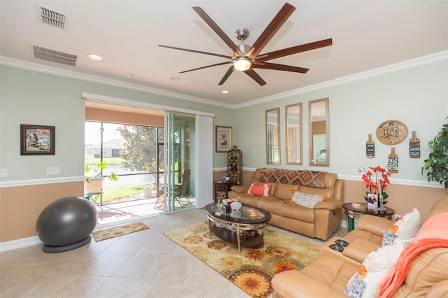 tiled living room with ceiling fan and ornamental molding