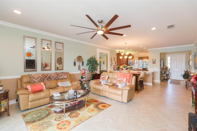 tiled living room featuring ornamental molding and ceiling fan with notable chandelier