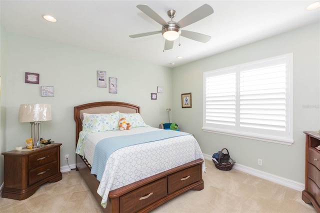 bedroom with light carpet and ceiling fan