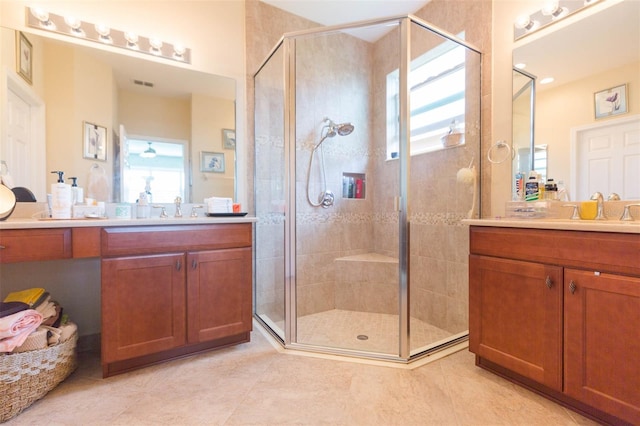 bathroom with vanity, tile patterned flooring, and a shower with door