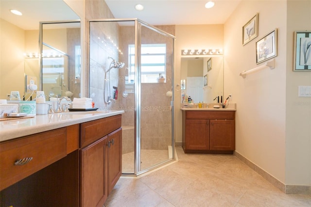 bathroom featuring vanity, tile patterned flooring, and an enclosed shower