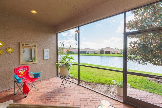 sunroom with a water view