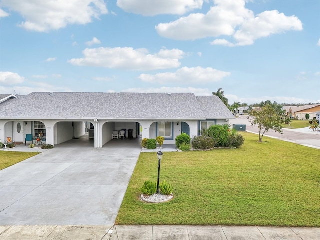 ranch-style home featuring a carport and a front lawn