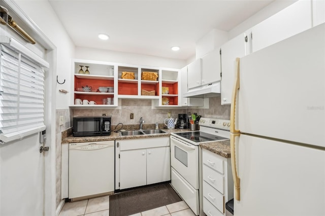 kitchen featuring white cabinets, sink, white appliances, and light tile patterned floors