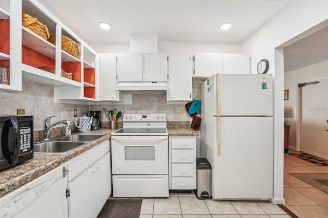 kitchen featuring white cabinetry, sink, white appliances, and light tile patterned flooring