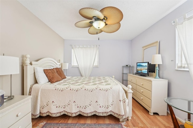 bedroom featuring light wood-type flooring and ceiling fan