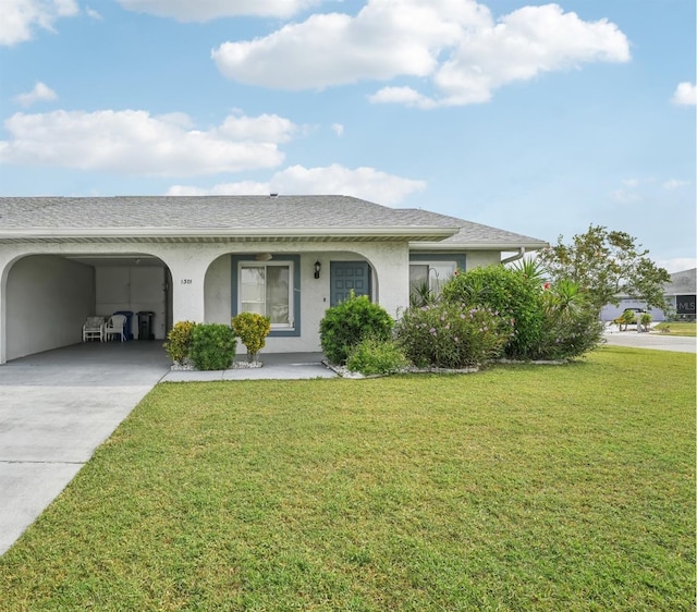 ranch-style home featuring a front yard and a carport