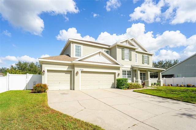 view of front of home with a garage and a front yard