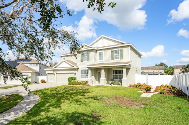 view of front of property with a garage and a front yard