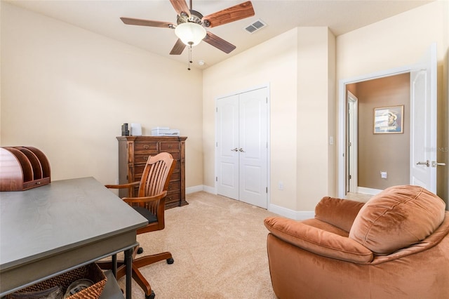 carpeted office featuring ceiling fan