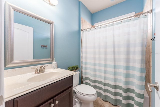 bathroom with toilet, vanity, tile patterned floors, and curtained shower